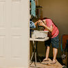 Linda Jackson washes her hair &copy; Elliot Ross