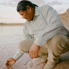 Nolan Stevens dips his hand into the Little Colorado River &copy; Elliot Ross